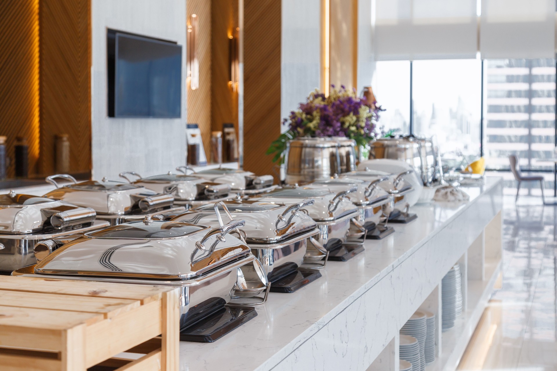 heating trays setup on the buffet line ready for service. breakfast and lunch buffet food catering banquet in hotel.